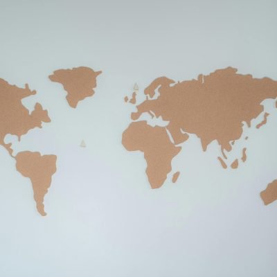 pexels photo 7634436 7634436 A minimalist cork board world map displayed on a white wall provides modern decor inspiration.